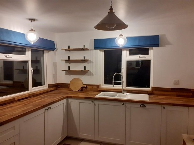 Shelves, blinds, lights, timber upstands and kitchen units.