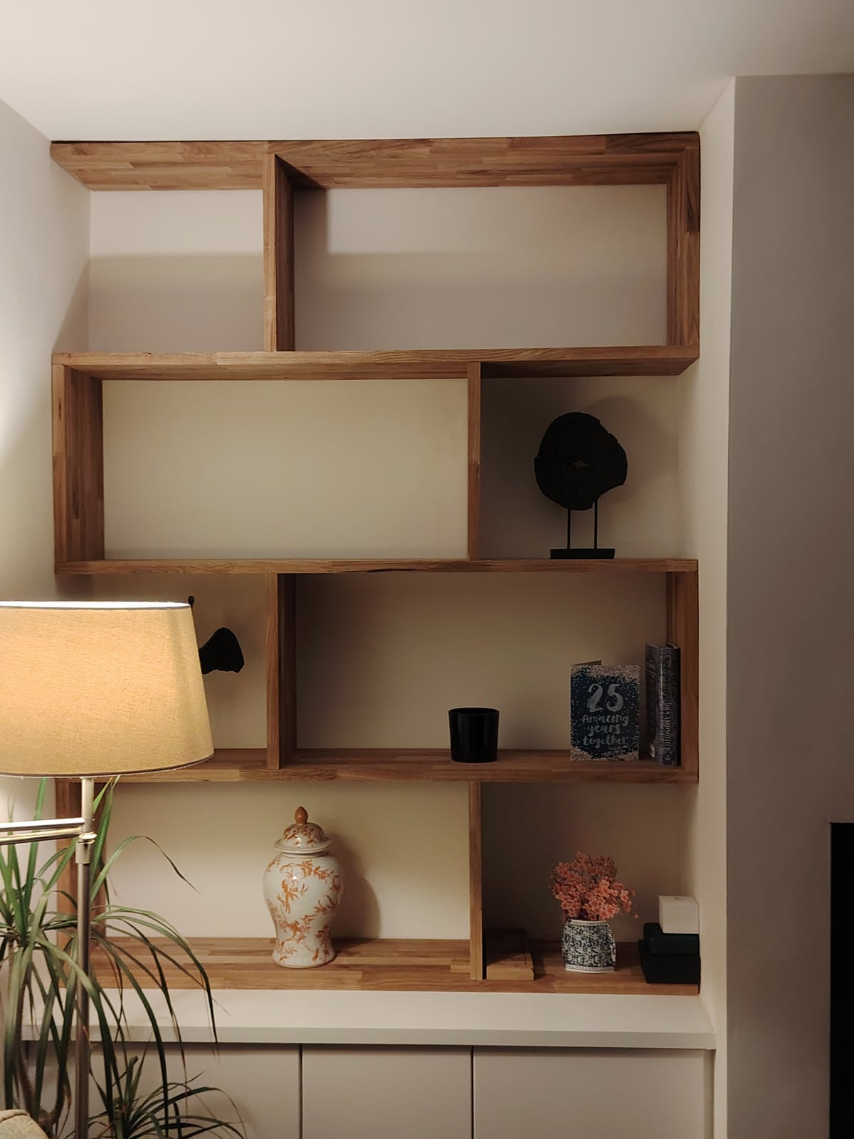 Custom-made timber shelving designed and built to fit this alcove